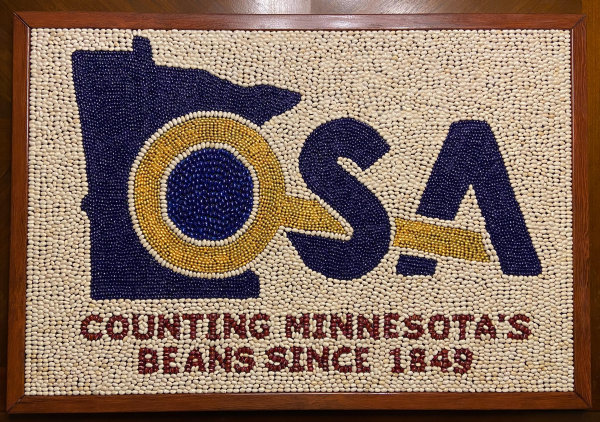 [Julie Blaha Guess the Number of Beans in the New Office of the State Auditor's Logo image]